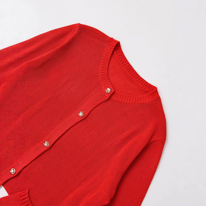 Women's knitted jacket with elegant button details and practical pockets Chic and Style