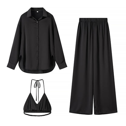 Women's set consisting of an elegant blouse, comfortable palazzo pants, and a trendy bralette Chic und Stil