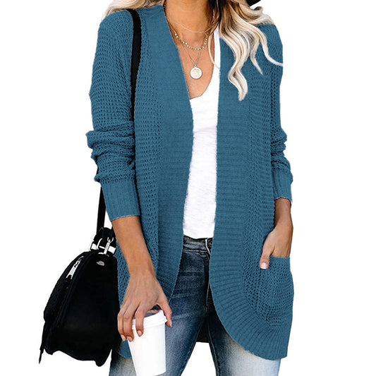 Veste en tricot pour femmes avec un motif de tricot moderne et des poches pratiques Chic und Stil