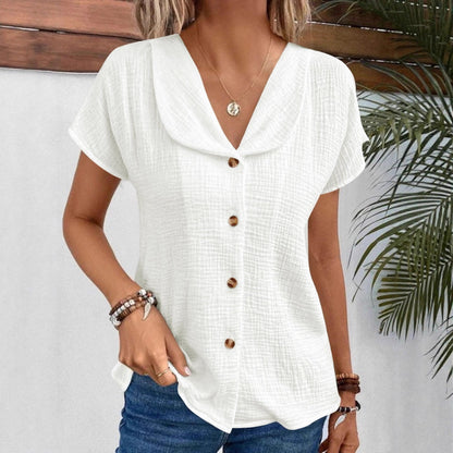 Chemisier féminin avec un col châle élégant et des détails de bouton décoratifs Chic und Stil
