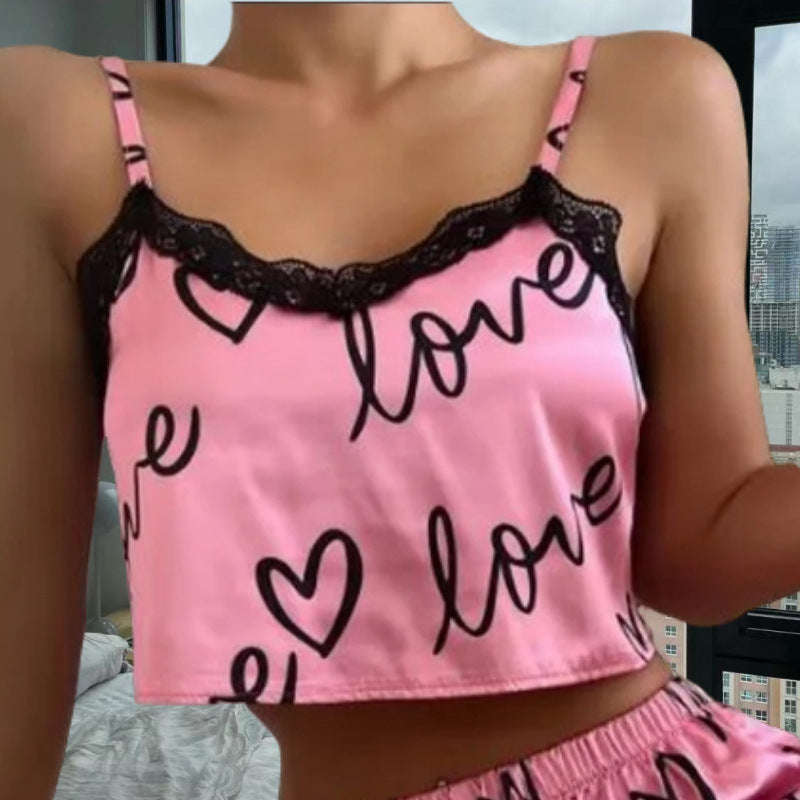 Chic and Style women's satin crop top and shorts set with hearts and lace accents