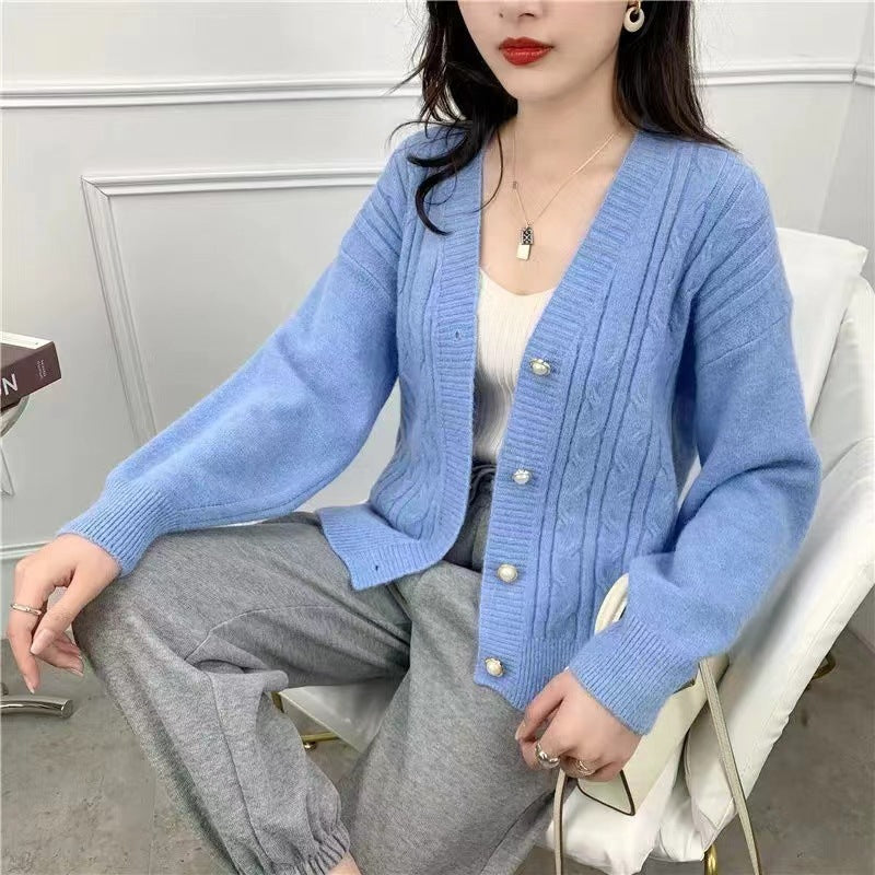 Knitted jacket for women with an elegant braid pattern and high-quality button details Chic and Style