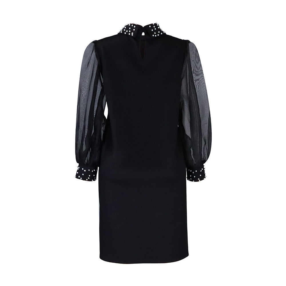 Robe pour femmes avec manches transparentes et ornements en perles Chic und Stil