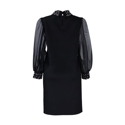 Robe pour femmes avec manches transparentes et ornements en perles Chic und Stil