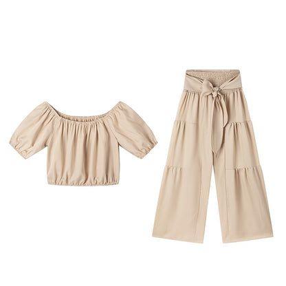 Woman Deep V-Neck Crop Top and High-Waisted Palazzo Pants Chic and Style