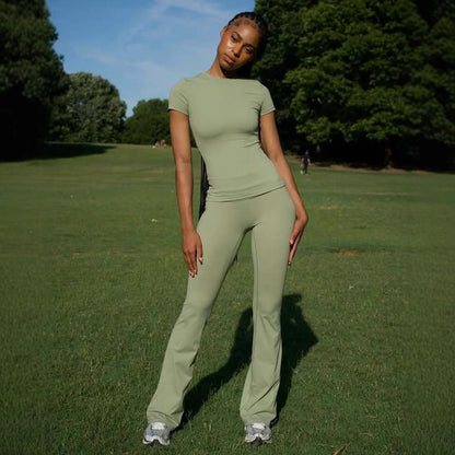 Chic and Style ladies' sporty outfit with fitted top and flared pants