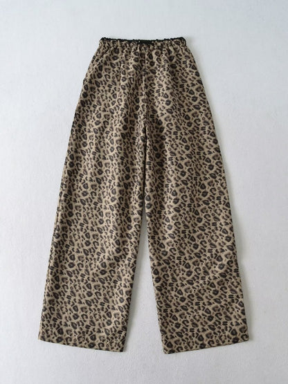 Trendy leopard wide-leg pants for women with elastic waistband and tie belt Chic and Style