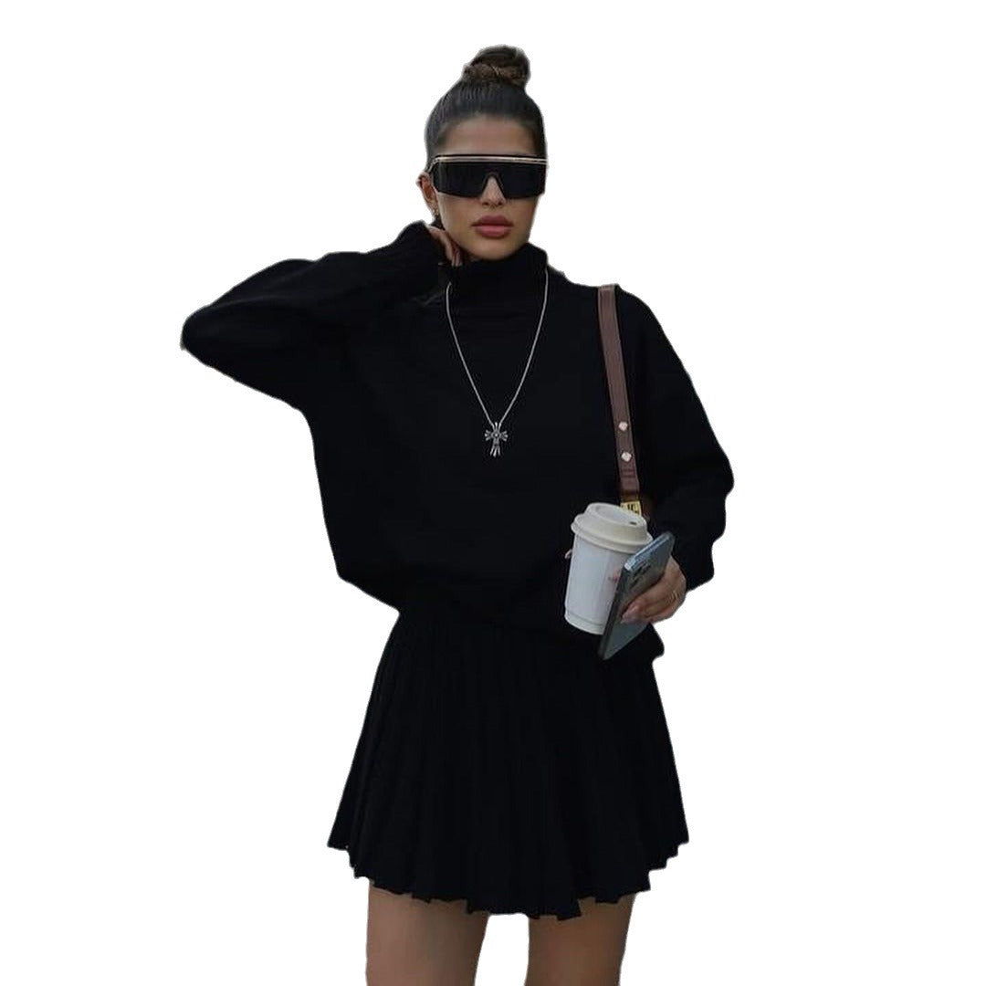 Pull en tricot pour femmes avec col haut et mini-jupe plissée Chic und Stil