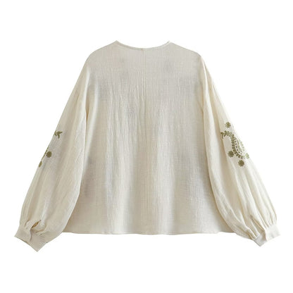 Blouse brodée pour femmes avec manches bouffantes et décolleté en V Chic und Stil