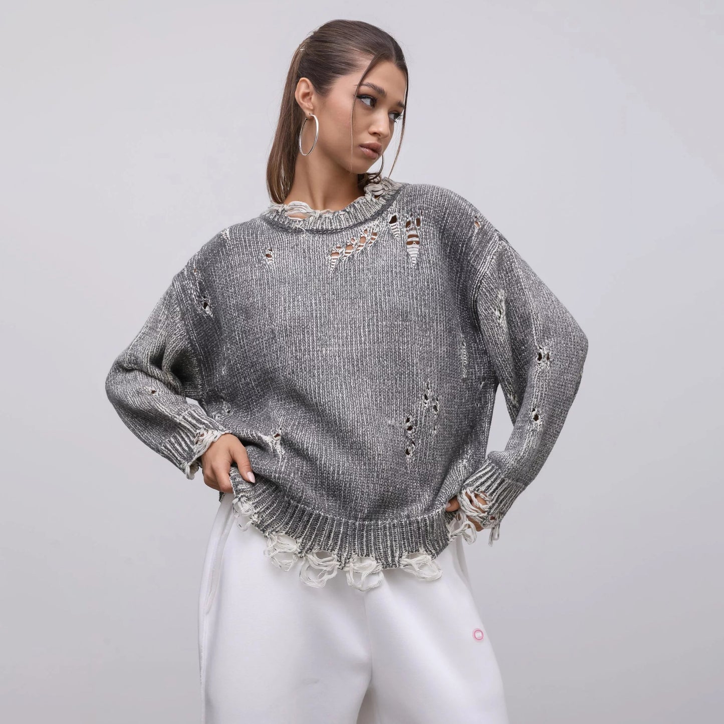 Ladies oversized knitted casual pullover with a unique hole pattern Chic and Style