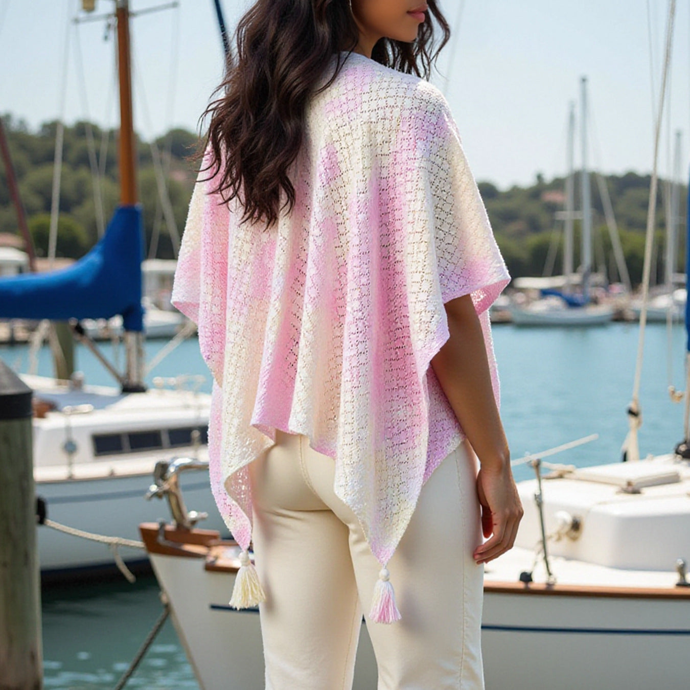 Airy knitted poncho for ladies with decorative fringes Chic and Style