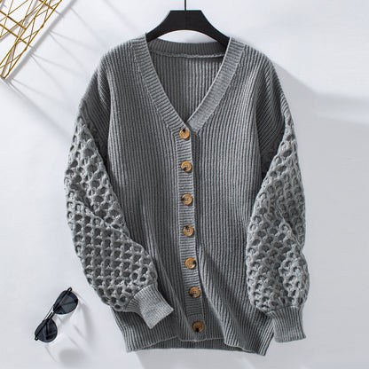 Veste en tricot pour femmes avec des manches texturées et des détails de boutons Chic und Stil
