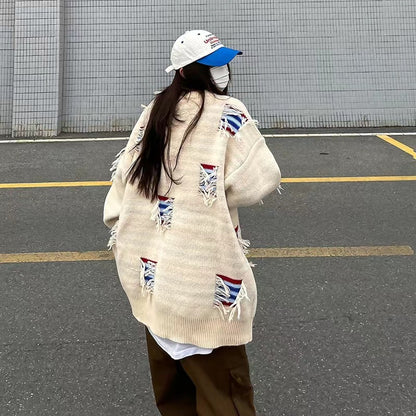 Urban knit pullover for women with unique ribbed details and a chic worn design