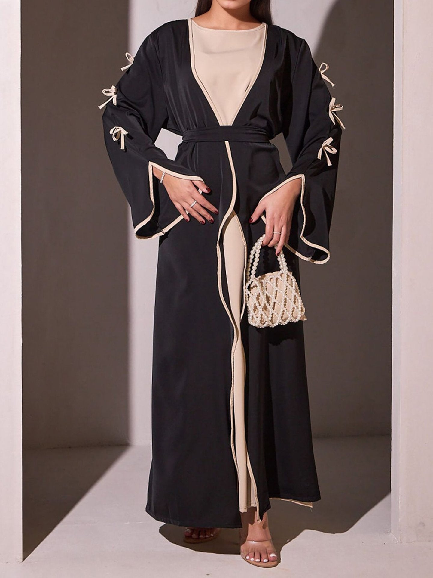 Robe maxi femme avec des détails de nœud élégants et une coupe fluide Chic und Stil