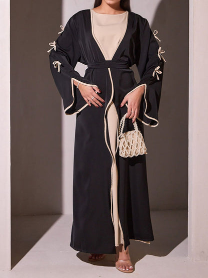 Robe maxi femme avec des détails de nœud élégants et une coupe fluide Chic und Stil