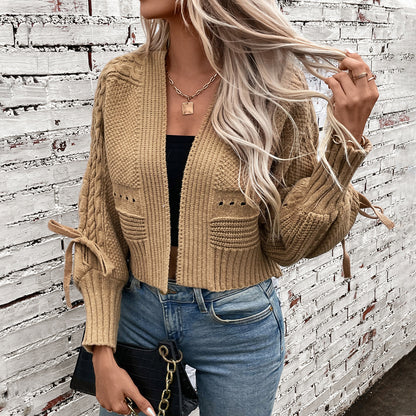 Veste tricotée à la mode pour femmes avec des manches volumineuses et un motif en cable Chic und Stil
