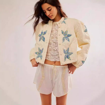 Dame veste matelassée avec broderies florales Chic und Stil
