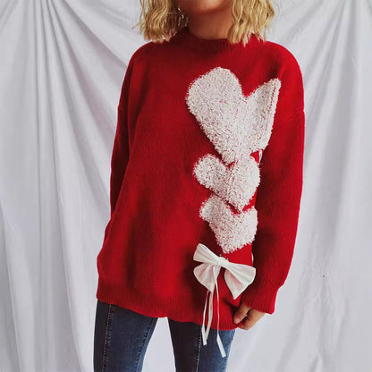Pull femme avec design en forme de cœur et nœud décoratif Chic und Stil