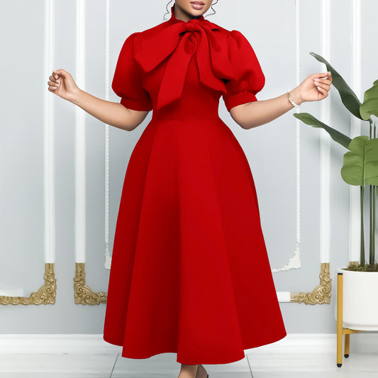 Robe midi femme avec un élégant noeud et des manches bouffantes Chic und Stil