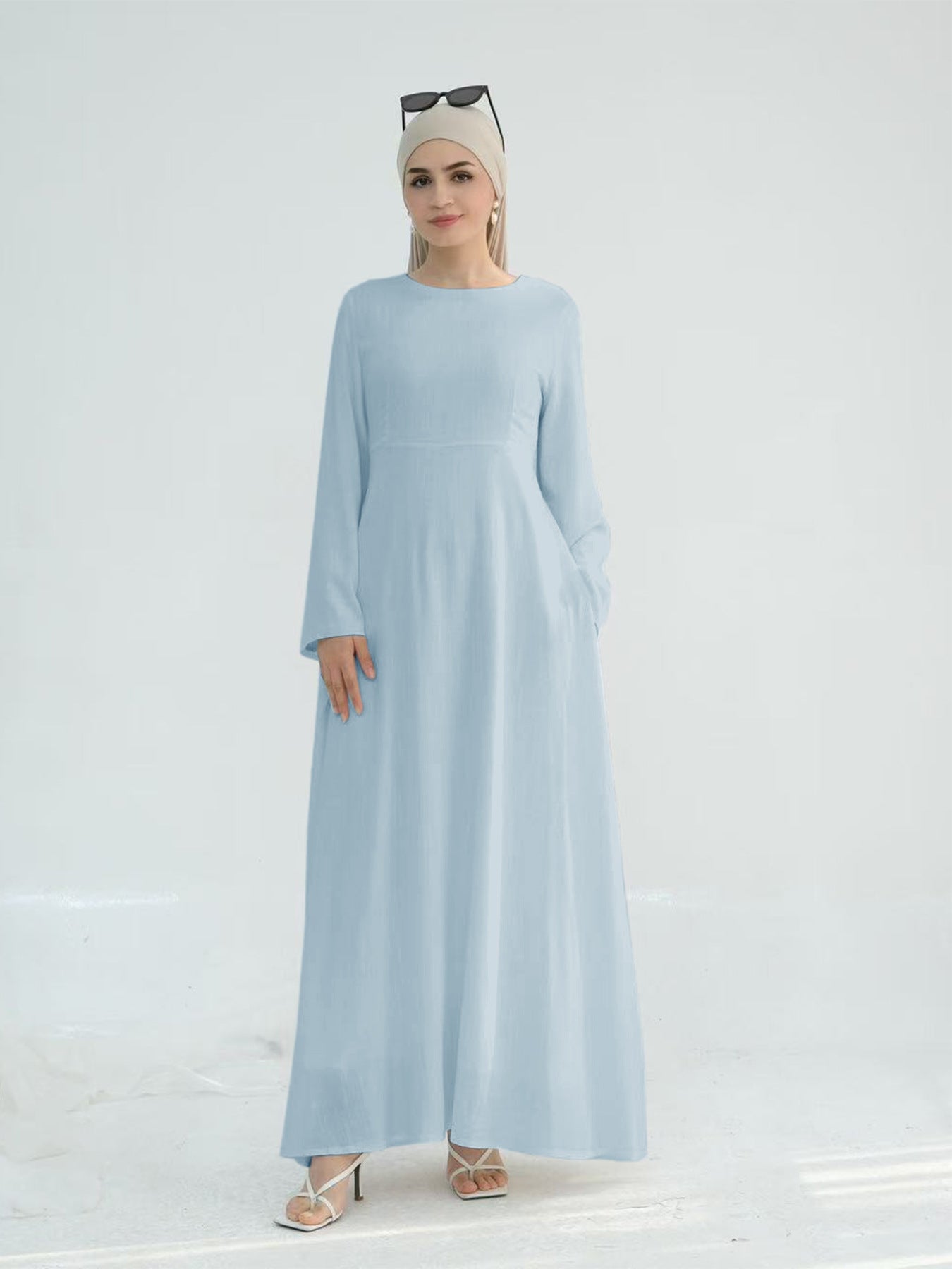 Robe maxi élégante pour dames avec des manches longues et des poches latérales Chic und Stil