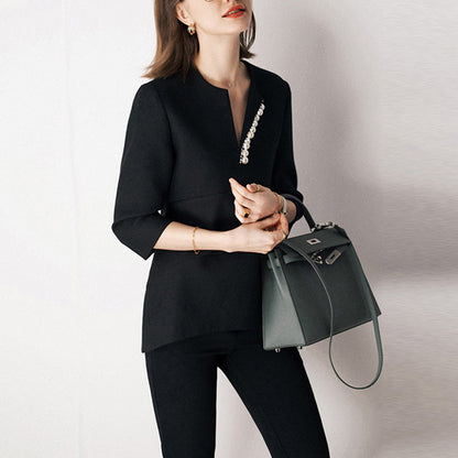 Blouse texturée élégante pour femmes avec détail de bouton décoratif Chic und Stil