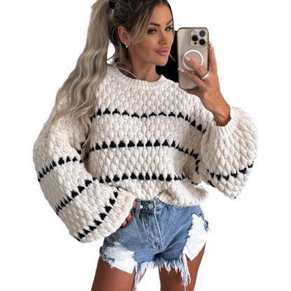 Pull en gros tricot pour femmes avec des manches volumineuses et un design de tresse moderne Chic und Stil
