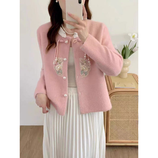 Pull à tricoter luxueux pour femmes avec détails de boutons décoratifs et volants Chic und Stil