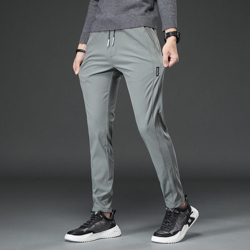 Men's slim fit sports pants with elastic waistband and practical zip pockets Chic and Style