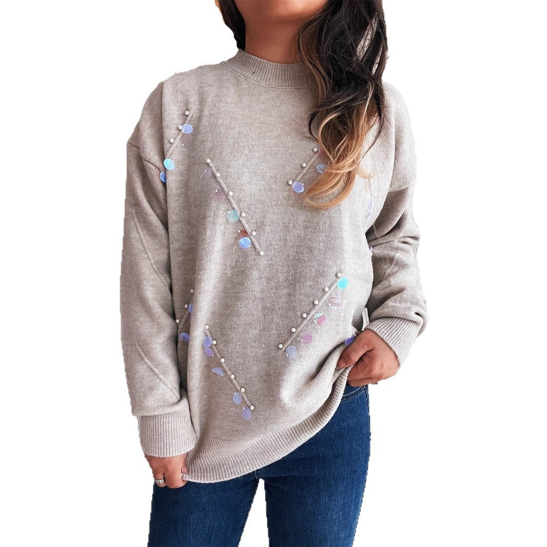 Pull femme avec des détails en perles et en strass à la mode Chic und Stil