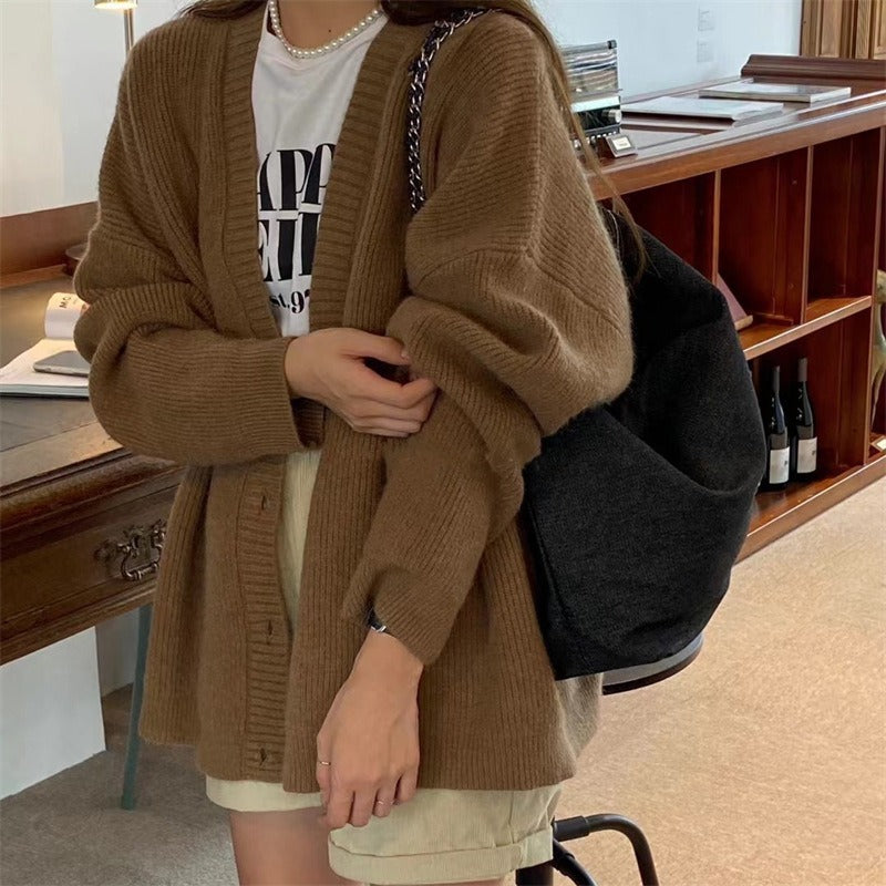 Dames gilet en tricot confortable avec épaules tombantes et détails de boutons Chic und Stil