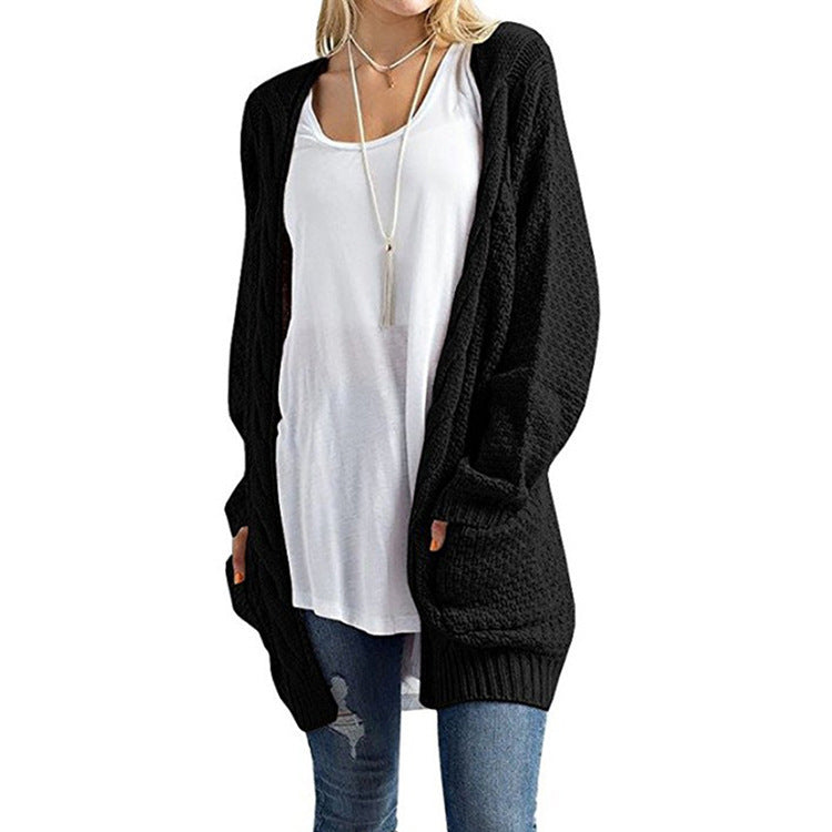 Veste en tricot pour femmes avec poches et structure à motifs en torsades détaillée Chic und Stil