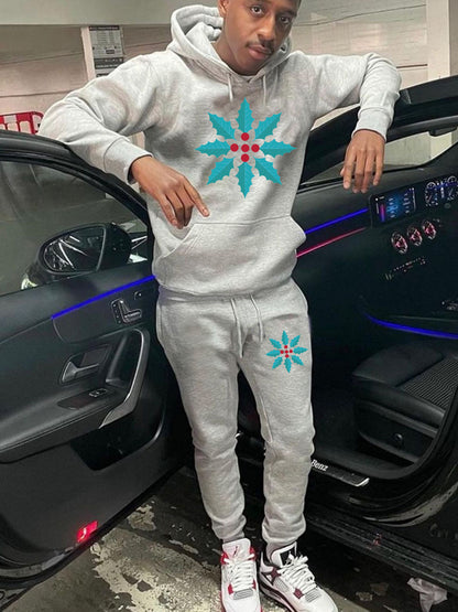 Chic and Style women's hoodie and jogger pants set with winter leaf pattern