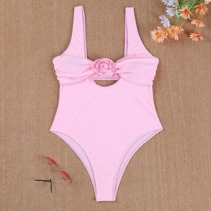 Ladies elegant one-piece swimsuit with floral accent and chic back neckline