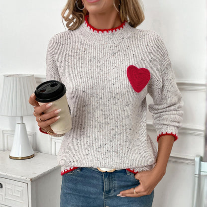Pull-over en tricot pour femmes avec application en forme de cœur et ourlet décoratif Chic und Stil