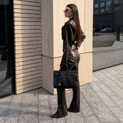 Elegant leather jacket for women with trendy blazer and slim pants