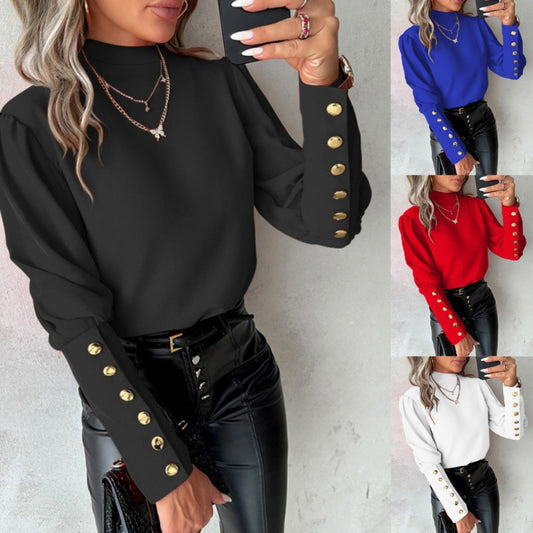 Blouse élégante pour femmes avec des manches bouffantes et des détails de boutons dorés Chic und Stil