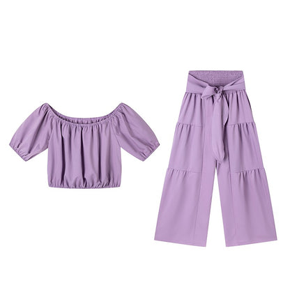 Woman Deep V-Neck Crop Top and High-Waisted Palazzo Pants Chic and Style