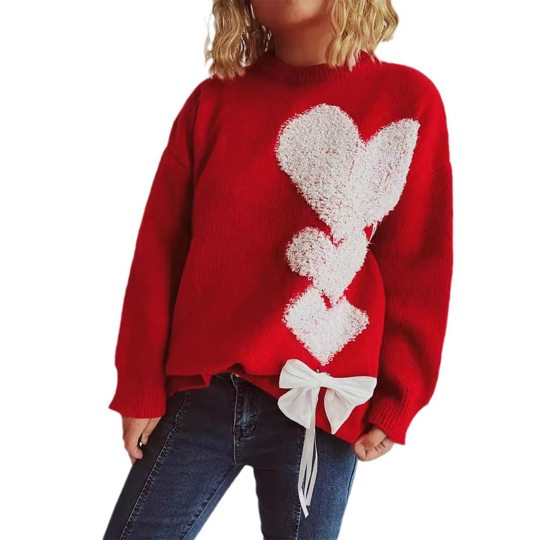 Pull femme avec design en forme de cœur et nœud décoratif Chic und Stil