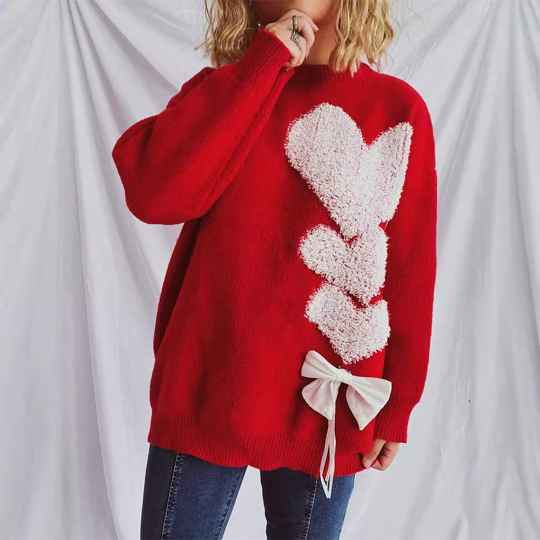 Pull femme avec design en forme de cœur et nœud décoratif Chic und Stil