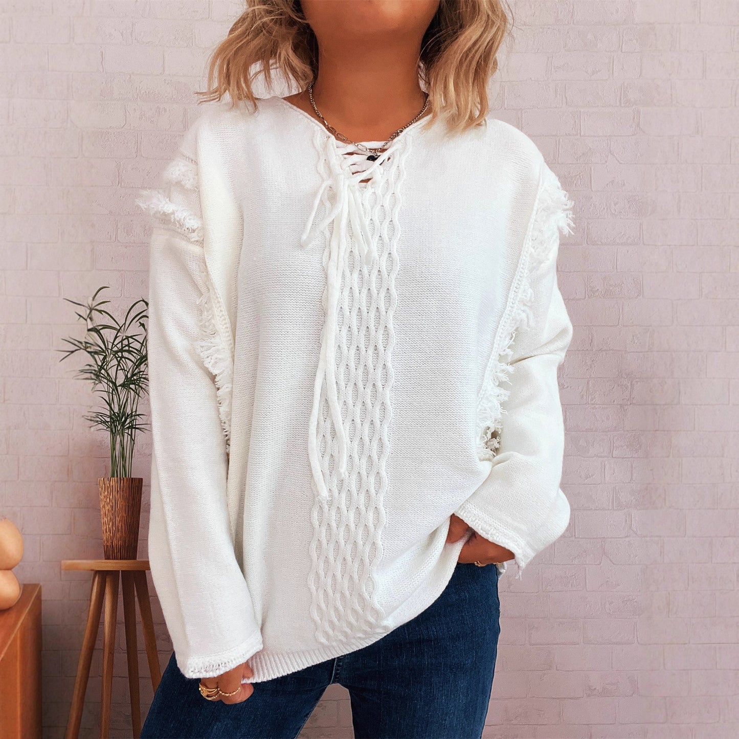 Pull en tricot oversize pour femmes avec un design de franges ludique et un motif en torsades Chic und Stil