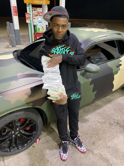 Women's hoodie and jogger pants set with urban graffiti design Chic and Style