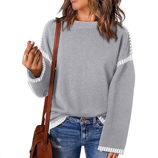 Pull féminin à la mode avec un matériau structuré et des détails en forme de rayures Chic und Stil