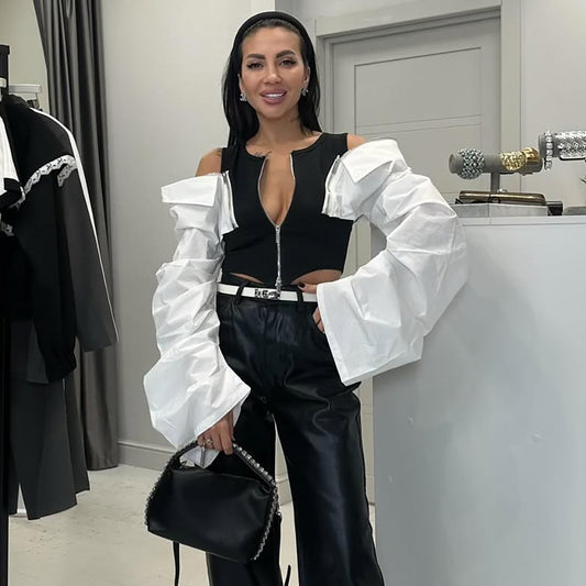 Dames Haut tendance avec des manches puffées frappantes et une fermeture éclair Chic und Stil