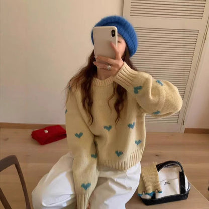 Femmes pull tricoté avec motif cœur et large bande Chic und Stil