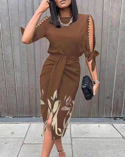 Robe portefeuille pour dames avec des manches décoratives et un ourlet floral Chic und Stil