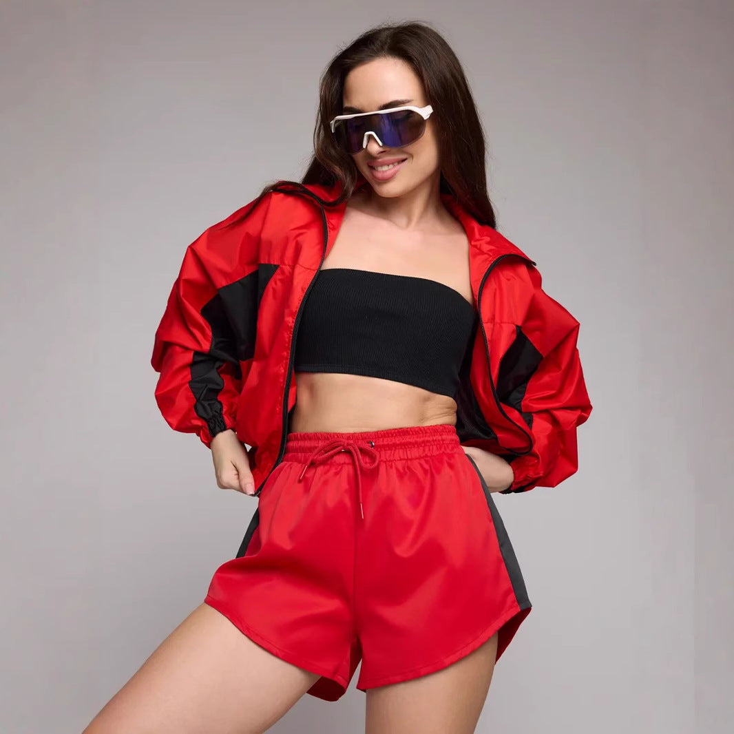 Women's athletic workout clothing with a highly functional jacket and chic stylish shorts