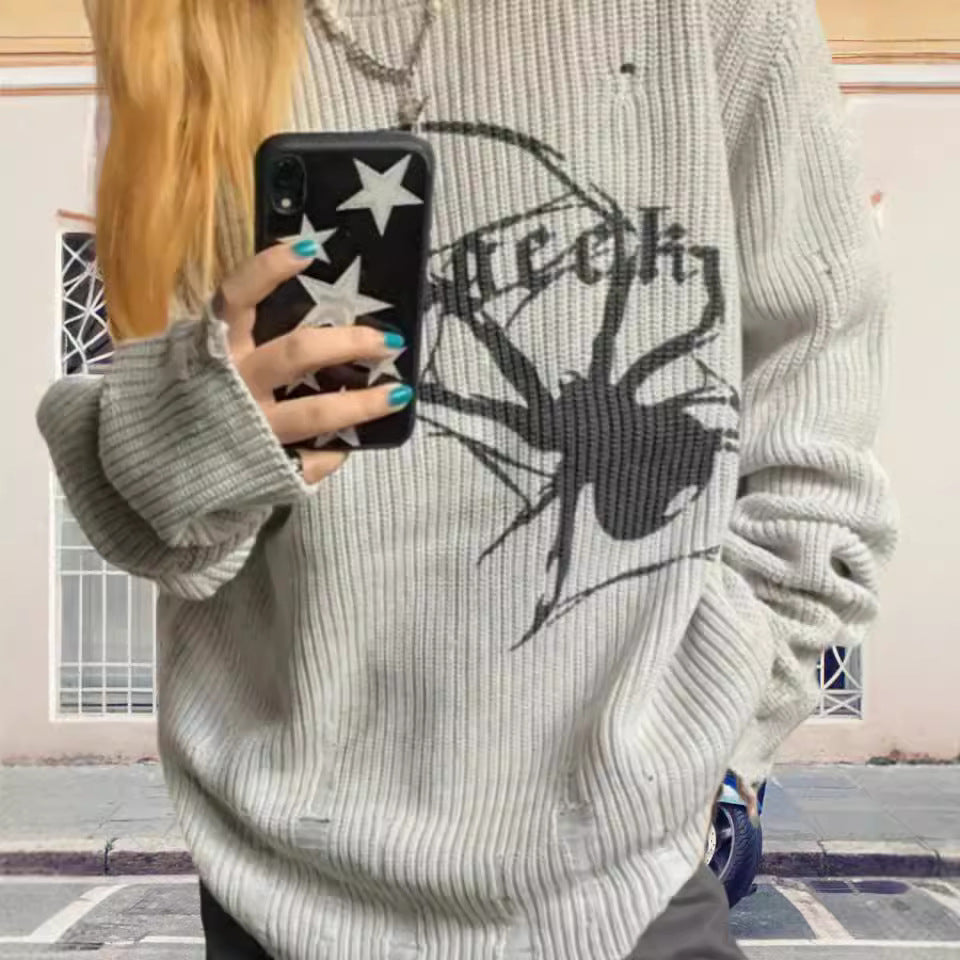 Pull en maille surdimensionné pour femmes avec un motif de araignée frappant Chic und Stil