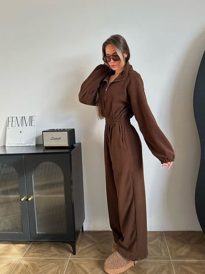 Women's fleece jumpsuit with large puff sleeves and a high neck. Chic and stylish.