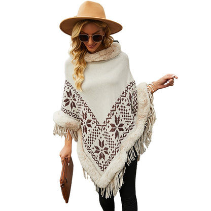Elegant women's poncho with decorative fringe design and faux fur trim Chic and Style