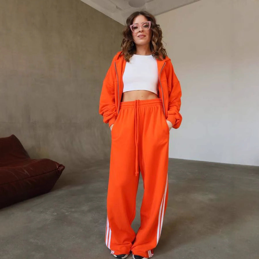 Trendy sports set for women with short tracksuit jacket and wide jogging pants Chic and Style